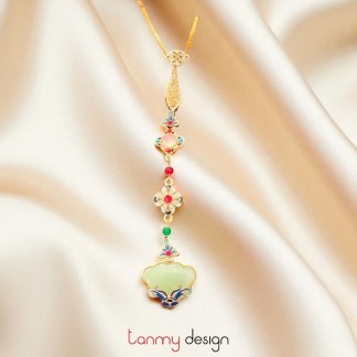 Gold metal brooch with green stone